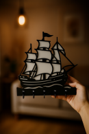 Black wooden wall hanger with hand-held sailing ship figure, multi-hook keychain and accessory hanger