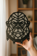 Handheld black and white geometric gorilla figure MDF keychain hanger, layered design and metal hook detail
